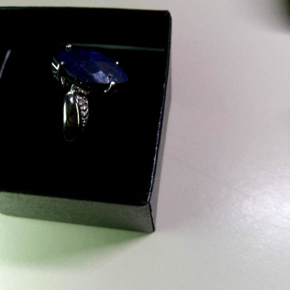 14k white gold over solid sterling silver diamonds and 2.5 CTW Sapphire. Natural
